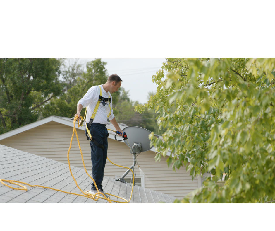Roof rejuvenation technician applying GreenSoy treatment to asphalt shingles